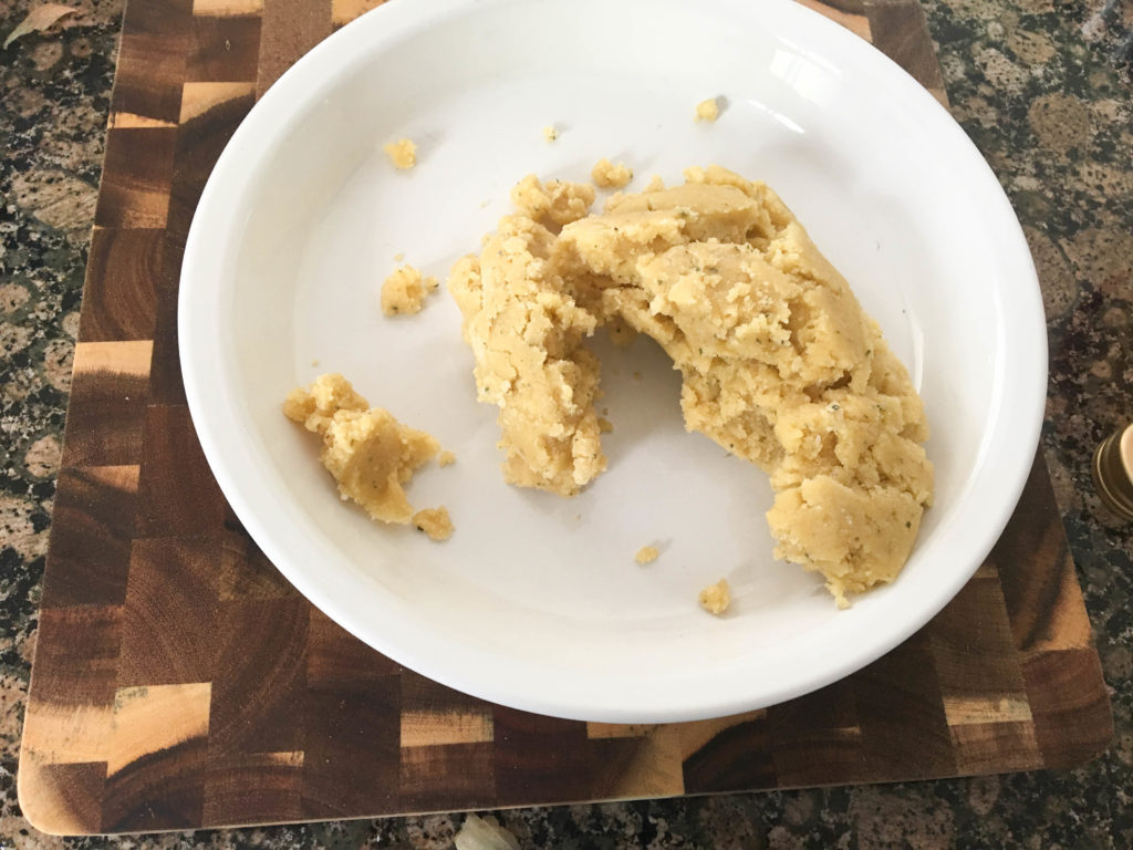 dough crumbled in a pie plate.