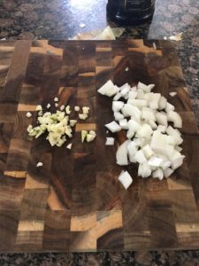 Roasted Frozen Cauliflower - chopped onion and garlic