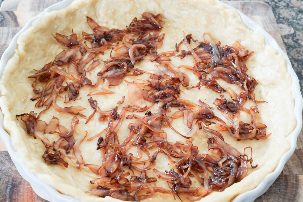 Layer caramelized onions over crust.